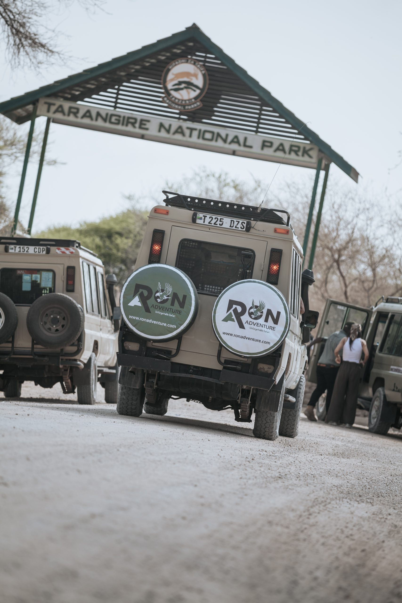 Safari jeep driving through Tarangire National Park with wildlife in view