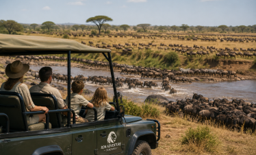 Family enjoying a game drive in Serengeti National Park Tanzania