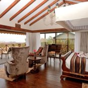 Luxury Tanzania safari accommodation overlooking Serengeti National Park with wildlife and premium safari lodge by Ron Adventure
